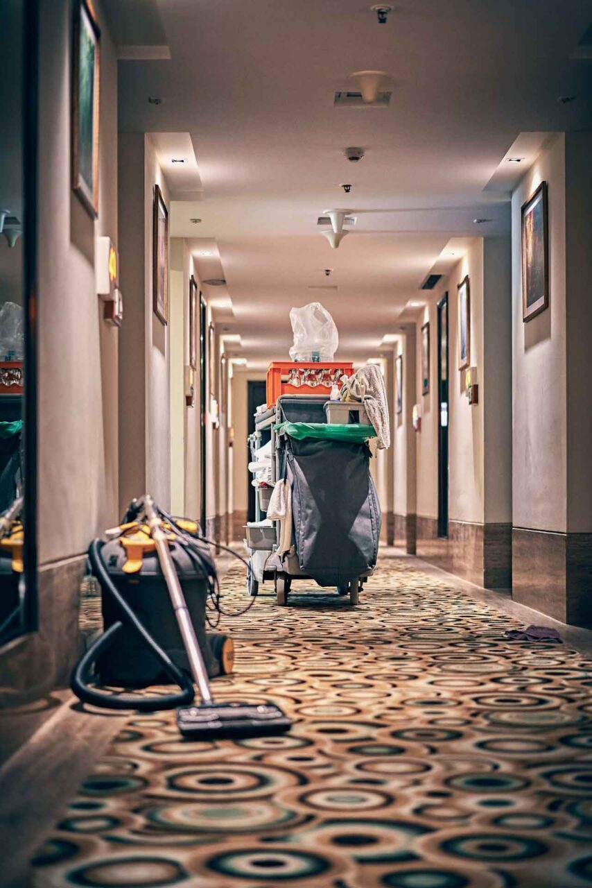 Janitorial cart in a hotel corridor, showcasing trusted janitorial solutions through our network of local experts.