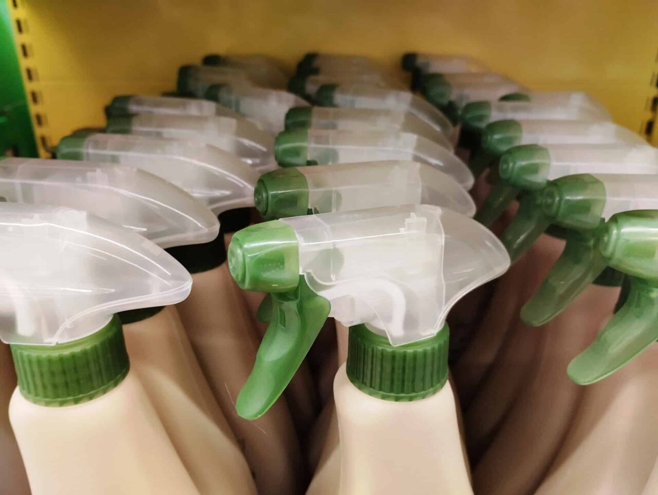 Spray bottles with green nozzles, ideal for distributors of trusted janitorial products and manufacturers.